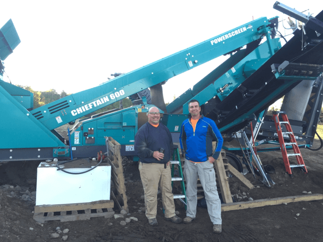 Keith Polister poses with his new screen print press prior to assembly.